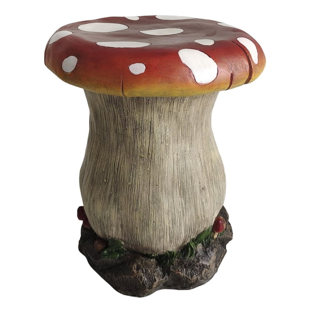 Angelo Décor 18-inch Mushroom Stool with a textured beige stem and red cap featuring white spots, made from weather-resistant materials for outdoor seating or side table use, with a naturalistic base resembling soil and small mushrooms.