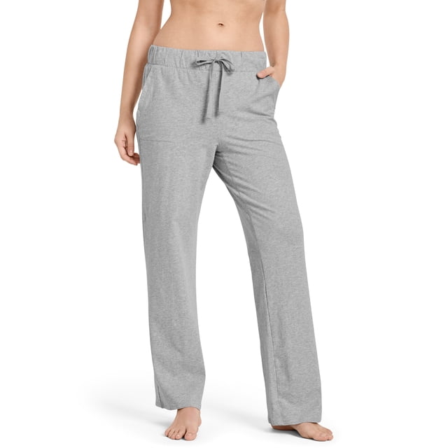 Jockey Women's Organic Cotton Stretch Pant in a light grey color, featuring a relaxed fit with a 29-inch inseam. Made from 95% organically-grown cotton with a hint of stretch, these breathable and soft pants are designed for comfort and movement. The pants include an elastic waistband with a drawstring for an adjustable fit, making them ideal for lounging or sleeping.