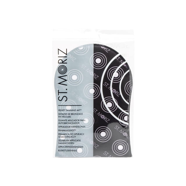 St. Moriz Tanning Mitt in a clear plastic pouch with black and grey circular pattern and multilingual text, featuring a lotion-proof barrier for streak-free application of all St. Moriz self-tanning products, washable and reusable for multiple uses.