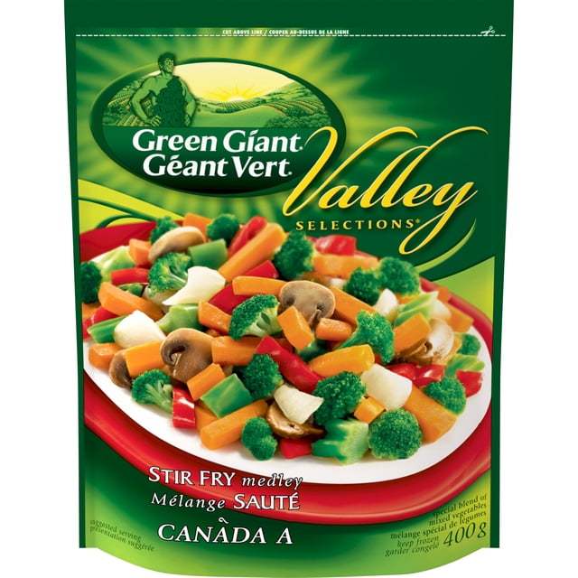 Green Giant Valley Selections* Stir Fry Medley, 400 g frozen vegetable blend in Green Giant packaging, front-facing view with label and stir-fry serving suggestion; made to be cooked and served over rice or noodles. Chef tip: add 500 g cooked protein and 60 mL stir-fry sauce; often used as a ready vegetable base for fried rice.