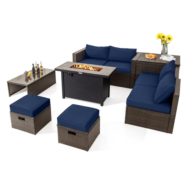 Patiojoy 9 Pieces Outdoor Patio Furniture Set with 42" Propane Fire Pit Table featuring a mix brown PE wicker frame and navy cushions. Includes a fire pit table with a ceramic top, coffee table, storage box, 2 ottomans, 2 corner sofas, and 2 armless sofas. The fire pit table provides 60,000 BTU heat output with adjustable flames and a removable lid for dual use as a coffee table. The set is space-saving and comes with waterproof covers for protection. Ideal for year-round outdoor gatherings.