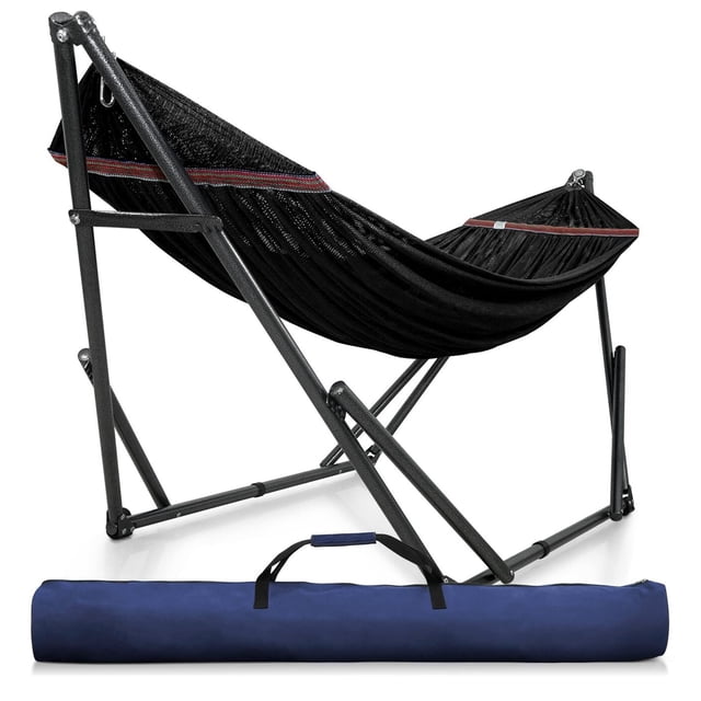 Tranquillo Universal 116" Double Hammock with Adjustable Stand & Bag in black. The hammock features a breathable 2-layered polyester net with stitched-in spreader bars to prevent cocooning, supported by a powder-coated steel frame with rubber feet stabilizers. It includes a folding stand with a 3-notch adjustable design and smooth ball bearings for noiseless rocking. The set comes with a blue carry bag for easy storage and transport. Suitable for indoor or outdoor use, it accommodates up to 550 pounds and measures 116 inches in length.