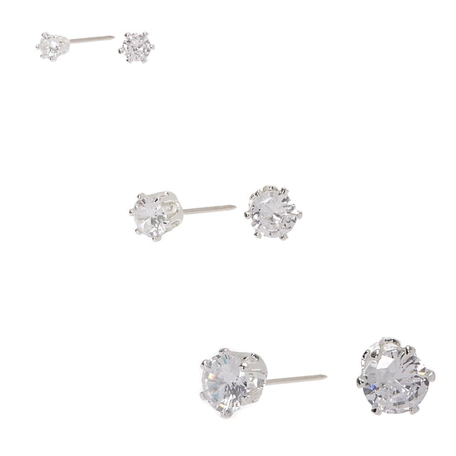 Claire's 3pk Silver Crystal Stud Earrings featuring three pairs of round crystal studs in varying sizes of 3mm, 5mm, and 7mm. Each earring is set in a sleek silver-tone setting, offering a timeless and elegant design. The crystals sparkle brilliantly, making them suitable for both casual and formal occasions.