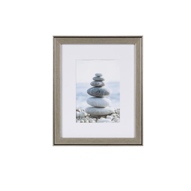 hometrends Aubree Silver Picture Frame with silver finish and black inner accent, holding a 5x7 photo of stacked smooth stones on a pebble beach, featuring a white mat and glass protection, suitable for tabletop or wall display.