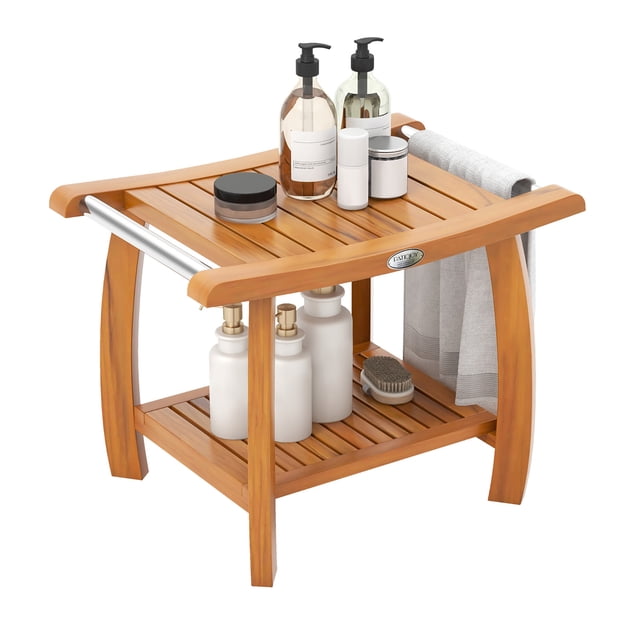 Gymax Teak Wood Shower Bench 2-Tier Wooden Shower Stool with curved seat, stainless steel handles, and slatted surface for drainage. Designed for bathroom aids and tub transfer use, it features a natural teak wood finish and a bottom shelf for storage. Suitable for saunas or as a versatile side table.