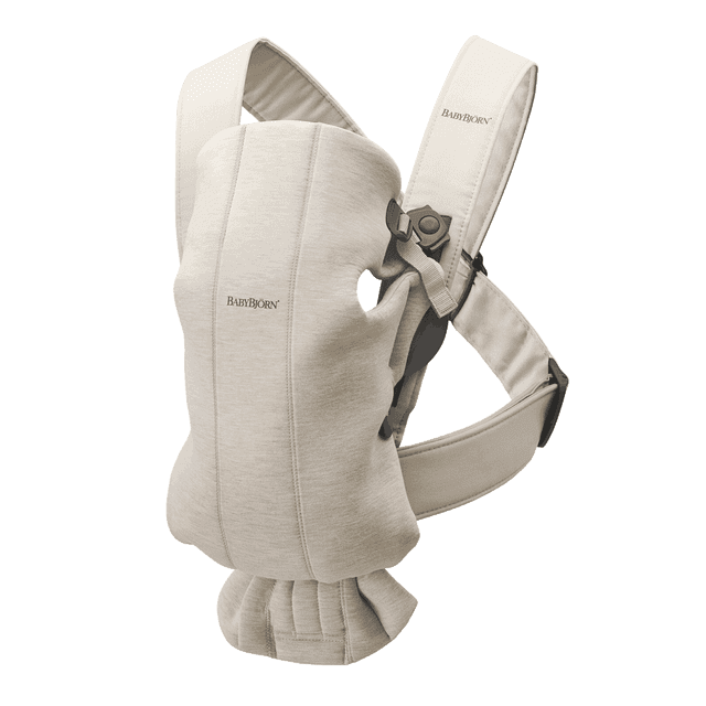 BabyBjorn Baby Carrier Mini in 3D Jersey fabric, light beige color. This front-facing baby carrier is designed for newborns up to 12 months, supporting weights from 7 lbs to 24 lbs. Features include adjustable seat and head support, cozy and flexible materials, and easy on-and-off functionality for parents.