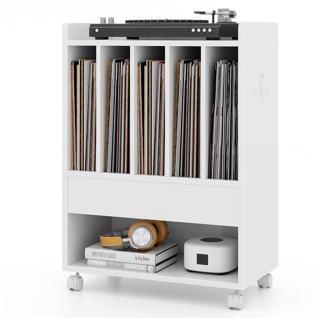 Gymax Record Player Stand on Wheels in white, featuring a pull-out drawer, open shelf, and four compartments for vinyl record storage. The stand includes a spacious top surface for a turntable, a bottom shelf for additional items, and side hooks for accessories. Equipped with four universal wheels, two of which are lockable, for easy mobility and stability. Made of MDF and engineered wood with rounded corners for safety. Dimensions: 21'' x 12'' x 29'' (L x W x H).