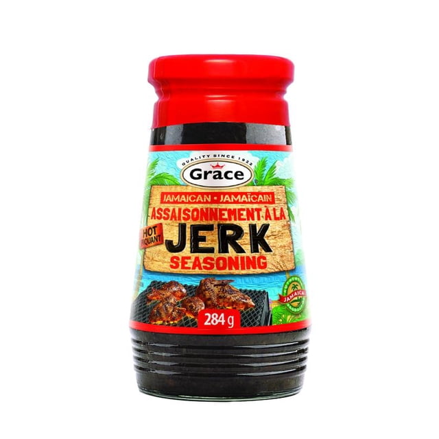 Grace Jerk Assaisonnement Fort, Bouteille de 284 g avec Bouchon Rouge et base Côtelée Noire, Présentant une Étiquette Bleue avec des Feuilles de Palmier et une image de Poulet Grillé, Mettant en Valeur l'Assaisonnement Jerk Jamaïcain Authentique et Épicé, Convenant à la Marinade de Viandes et de Légumes.