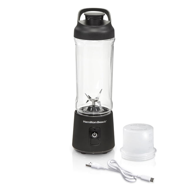 Hamilton Beach Blend Now Portable Cordless Blender with stainless steel blades, clear 16 oz jar with black base and lid, USB charging cable, and white measuring cup, suitable for blending smoothies, protein shakes, and sauces on the go.