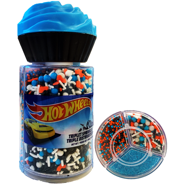 Twinkle Hot Wheels Sprinkle Mix in a clear plastic container with a black cupcake-shaped lid, filled with multicolour sprinkles in blue, white, black, and orange shapes including small balls and car-themed pieces, ideal for decorating cupcakes, cookies, and cakes, with a separate round divided tray showing the sprinkles sorted by type.
