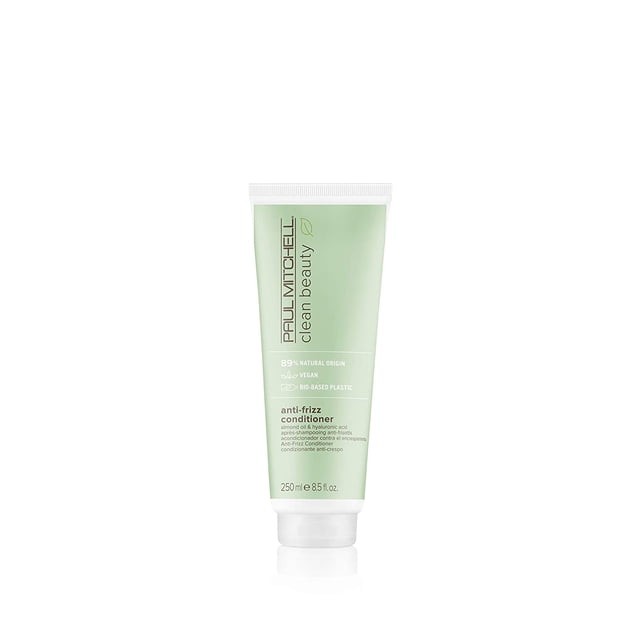 Paul Mitchell Clean Beauty Anti-Frizz Conditioner 8.5oz in a light green tube with white cap. A vegan conditioner made with 89% natural origin ingredients, including almond oil and hyaluronic acid, to smooth frizzy hair, hydrate strands, and add shine. Packaged in bio-based plastic.