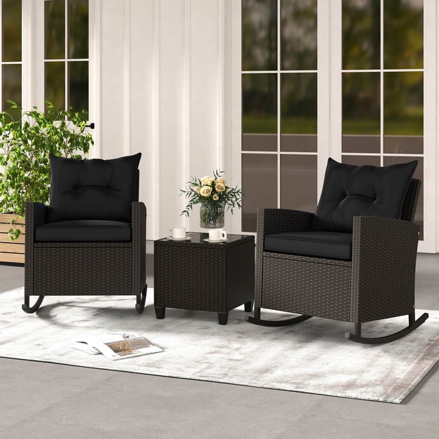 Costway 3 PCS Patio Wicker Rocking Set with Tempered Glass Table & Soft Cushions Outdoor Black. This set features two mix brown PE rattan rocking chairs with black cushions and a square coffee table with a tempered glass top. The chairs include ergonomic backrests, curved armrests, and non-slip stoppers for stable rocking. The cushions are 5.5 inches thick for the back and 3 inches thick for the seat, with removable covers for easy maintenance. The coffee table is designed with suction cups to secure the glass top. Perfect for patios, porches, or poolside relaxation.