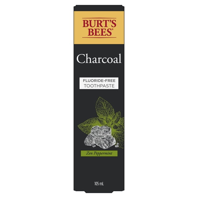 Burt’s Bees Toothpaste, Fluoride Free, Charcoal, Zen Peppermint in a 105 mL black rectangular box with a yellow top panel featuring the Burt’s Bees logo, white text reading 'Charcoal' and 'Fluoride-Free Toothpaste', and an illustration of charcoal pieces and peppermint leaves, designed to remove surface stains and freshen breath.