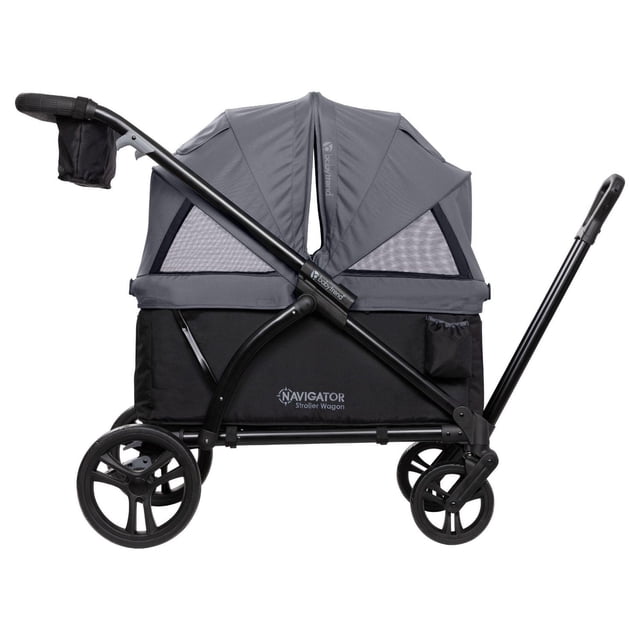 Baby Trend Navigator® 2-in-1 Stroller Wagon side view with grey adjustable dual canopies with mesh panels, black seating area with two 3-point harnesses, durable black frame, 8-inch front and 11-inch rear wheels, adjustable hide-away pull handle, and stroller handle with parent tray featuring two cupholders and a center console, suitable for toddlers up to 110 lb.