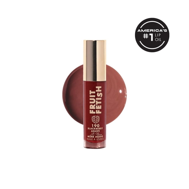 Milani Fruit Fetish Lip Oil in 190 Blackberry Agave shade with a glossy berry red tint swatch behind the tube, featuring a gold cap, delivering nourishing hydration with fruit extracts and vitamin E for comfortable, non-sticky wear.