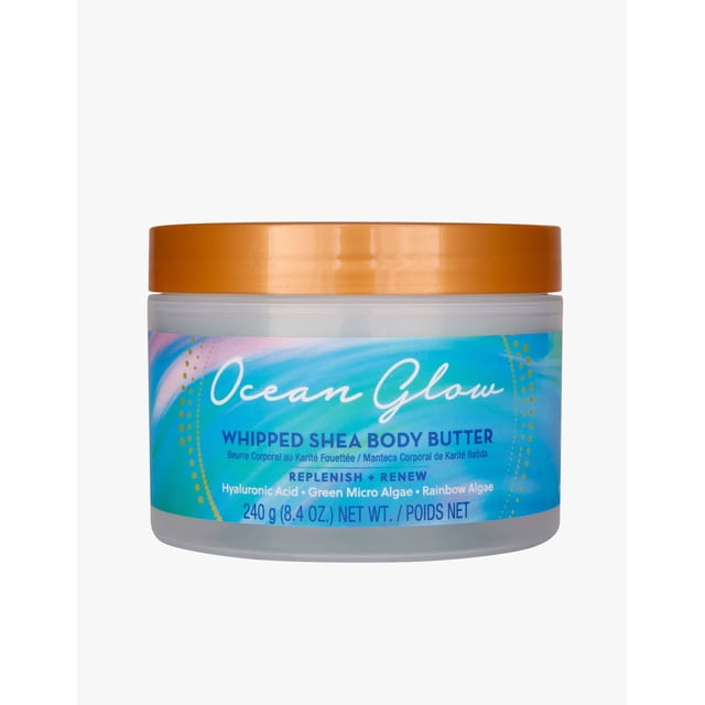Tree Hut Whipped Body Butter Ocean Glow, 8.4 oz, displayed in a clear jar with a golden lid. The label showcases an ocean-inspired design and highlights its nourishing formula with hyaluronic acid, green microalgae, and rainbow algae. This vegan, paraben-free body butter features a lightweight, whipped texture and a tranquil scent combining amber, tropical seas, apple, and apricot.