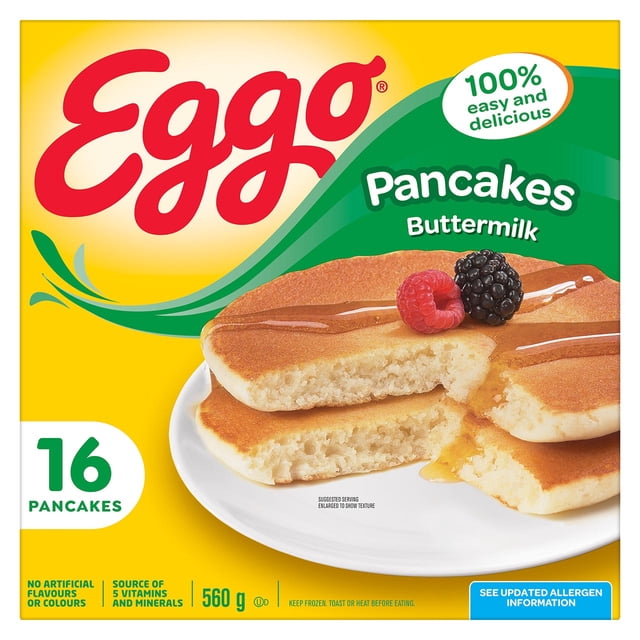 Eggo Buttermilk Pancakes 16 count box showing three golden brown pancakes on a white plate with syrup and fresh berries, highlighting frozen breakfast convenience and a source of vitamins and minerals, suitable for quick meals.