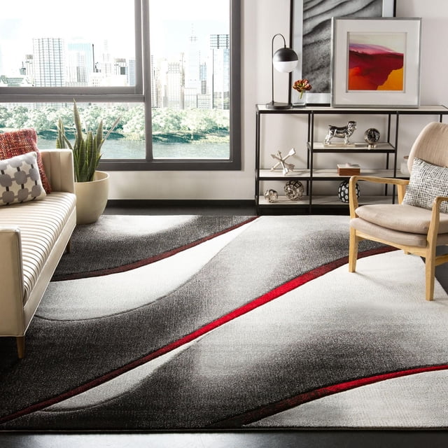SAFAVIEH Hollywood Candyce Tapis Abstrait 8 Pieds x 10 Pieds avec Motif de Vagues Géométriques Gris et Rouge Style Mi-Siècle Moderne, Exposé dans un Salon Contemporain avec sofa beige et Fauteuil en Bois, Convient aux Zones Très Passantes et à la Déco Maison Moderne.