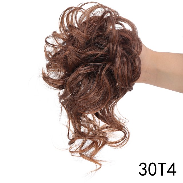 Messy Bun Hair Piece Synthetic Messy Bun Scrunchies Extensions in a rich brown shade, styled with loose curls and waves. Made from synthetic material, this hairpiece is designed to create a voluminous and casual updo. The image shows the hairpiece held in hand, highlighting its texture and color. Suitable for quick hairstyling and enhancing hair volume.