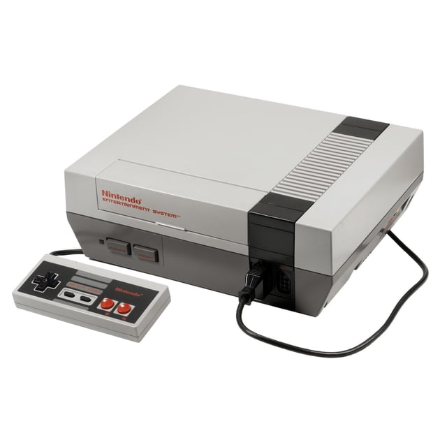 Console Nintendo Entertainment System NES 1985 Remise à Neuf avec Manette Officielle OEM. la Console Grise Présente un design Rectangulaire avec un Emplacement pour Cartouche avant, des Boutons d'Alimentation et de Réinitialisation, et une Manette OEM Connectée avec un Pavé en D Classique et des Boutons Rouges. Contrôlée et Nettoyée Professionnellement, Elle Peut Révéler des Imperfections Cosmétiques Mineures. Idéale pour les Amateurs de Jeux Rétro et les Collectionneurs de Système de Jeu vintage.