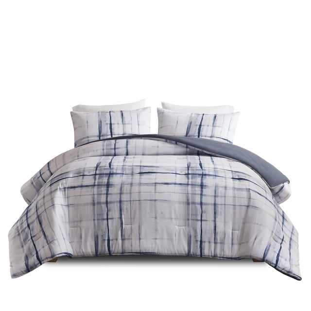 Beautyrest Reversible 3pc Comforter Set + Bonus Duffle Storage Bag with a double/queen comforter featuring a white base with blue grid print reversible to solid dark blue, two matching pillow shams with envelope closures, made of heavyweight microfiber, machine washable, ideal for versatile bedroom decor.