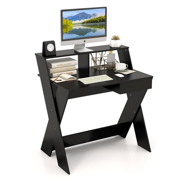 Gymax Computer Desk Study Writing Table Small Space with Drawer and Monitor Stand in black. Features a raised monitor stand for ergonomic viewing, a spacious tabletop for work essentials, and a pull-out drawer for additional storage. Made of engineered wood and P2 MDF with X-shaped legs for stability. Suitable for home offices, bedrooms, or study areas.