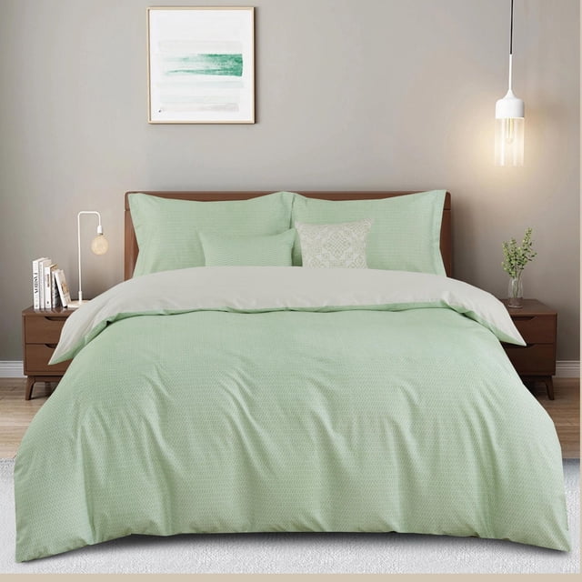 Johnson Home 5-Piece Comforter Set in light green with subtle pattern, crafted from 200-thread count 100% cotton for softness and breathability. Includes comforter, two shams, and two decorative cushions on a wooden bed frame in a neutral-toned bedroom with modern lighting, suitable for year-round use.