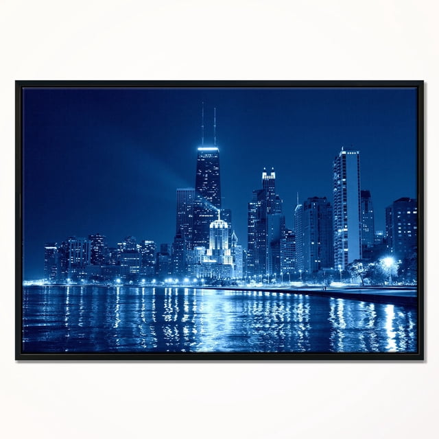 Design Art Bleu Skyline de Chicago Nuit Impression d'Art sur Toile Encadrée Présentant une Vue avant Centrée de la Skyline Nocturne Illuminée de Chicago avec des Reflets sur l'Eau, Imprimée avec une Encre Résistante à la Décoloration sur Toile Enveloppée de Galerie Tendue sur un sous-Cadre en Bois de 1 Po dans un Cadre Flottant Noir, Incluant un kit de Suspension pour une installation Facile. Cette Toile Encadrée Convient Aussi pour Rehausser le décor du Bureau Ou du Salon.