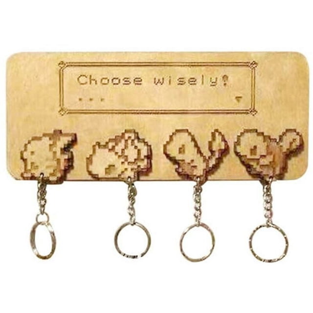 Jinsinto Pokemon Wooden Key Holder, a wall-mounted key ring holder made of lightweight and durable wood. Features a rectangular design with engraved pixel art of four Pokemon characters and the phrase 'Choose wisely!' above them. Includes four metal key rings attached to the wooden base. Compact size of 15x8x0.6 cm, suitable for hallways, kitchens, or entryways. Ideal for organizing car and house keys while adding a decorative touch to your home.