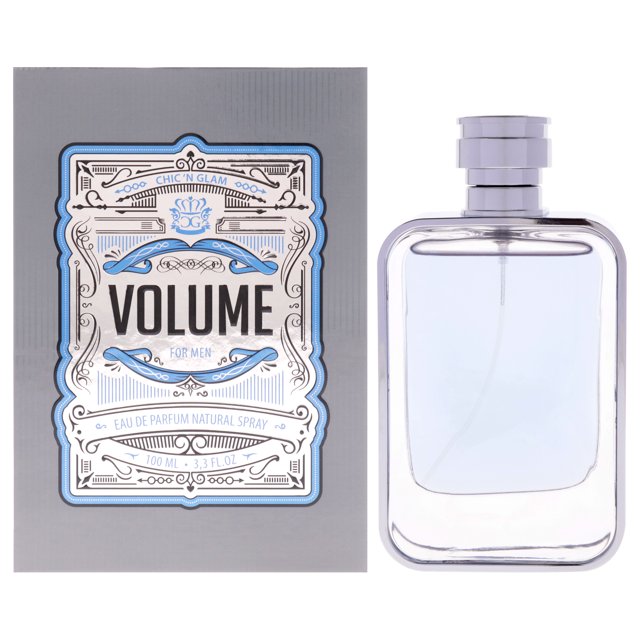 Volume by Chic N Glam for Men - 3.3 oz EDP Spray. A woody aquatic fragrance featuring a blend of bergamot, musk, and green notes. The image shows a rectangular clear glass bottle with a silver cap, alongside its grey packaging adorned with intricate blue and silver detailing and the 'Volume for Men' branding.