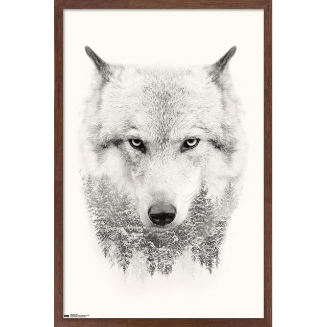 Wolf - Trees Wall Poster, 22.375" x 34", depicting a front-facing wolf head with detailed gray and white fur and piercing eyes, blending into a snowy evergreen forest at the base, printed on glossy satin finish paper with a brown wood frame, ideal for home décor and wall art.