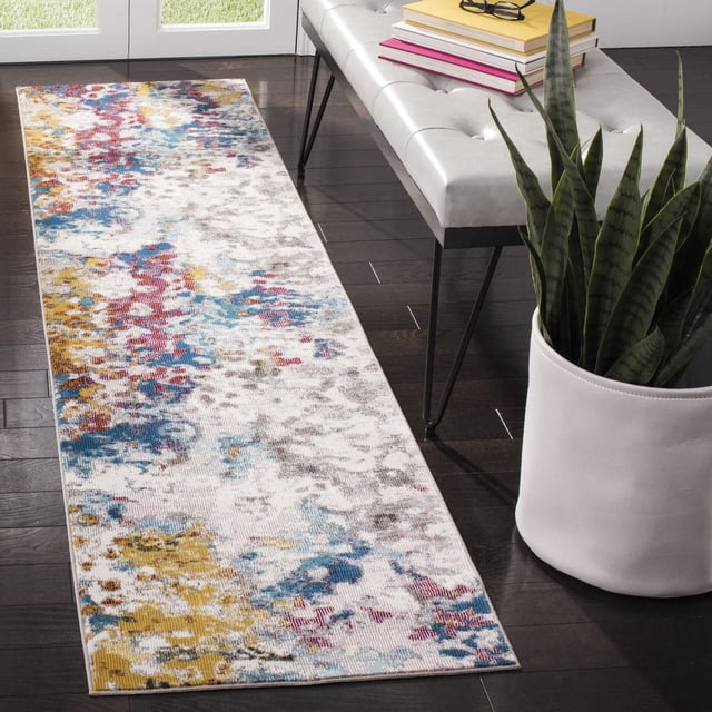Safavieh Aria Augustin Tapis Abstrait avec un Motif Abstrait Vieilli d'Inspiration Persane en Bleu, Jaune, Rouge et Gris Vibrants sur Fond Clair, Tissé Mécaniquement à Partir de Fils Synthétiques pour la Durabilité, Placé sur des Planchers de Bois Franc Sombres à Côté d'Un Banc Capitonné Blanc avec des Livres et une Plante Serpent dans un pot Blanc, Idéal pour Accentuer les Intérieurs Modernes et durable pour les Espaces à Fort Passage.