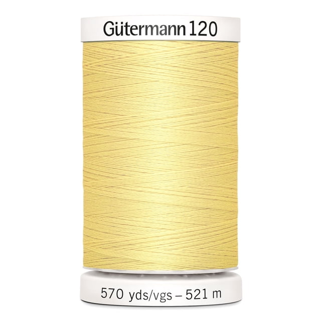 Gutermann 120 100% polyester all purpose thread spool in pale yellow with white plastic caps labeled with brand and length 570 yards (521 meters), suitable for machine and hand sewing various fabrics including cotton, synthetics, and natural fibers, also ideal for craft and mending projects.