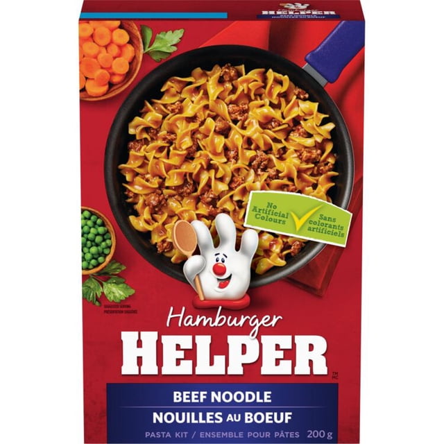 Hamburger Helper Boîte de kit de Pâtes de Nouilles au Bœuf Montrant une Poêle avec des Nouilles de Bœuf et d'Oeuf Cuites dans une Sauce, à Côté de Bols de Carottes Tranchées et de Pois Verts sur un Fond Rouge, Mettant en Vedette la Mascotte au Gant Blanc Tenant une Cuillère en Bois et une Étiquette de Couleur Non Artificielle, 200 g.