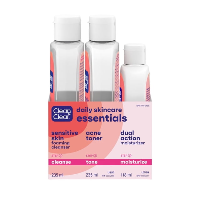 Clean & Clear Daily Skin Care Essentials Recruitment Pack containing three bottles: 235 ml sensitive skin foaming cleanser, 235 ml acne toner, and 118 ml dual action moisturizer in clear and white plastic bottles with white caps, packaged in a pink and coral box labeled with steps cleanse, tone, and moisturize for daily skincare.