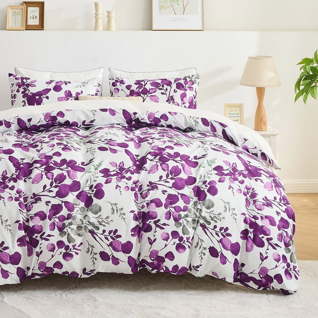 Hitime Queen Duvet Cover Set with a vibrant watercolor floral pattern in purple and grey tones on a white background. Made from fade-resistant, breathable microfiber fabric for all-season use. Includes one duvet cover and two matching pillowcases with an envelope design. Displayed in a cozy bedroom with neutral decor.