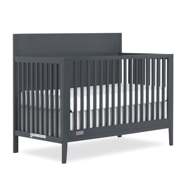 Fisher Price by Dream On Me Delani 5-in-1 Convertible Crib in carbon finish with vertical wooden spindles and solid headboard, made from sustainable New Zealand Pinewood with a child-safe non-toxic finish, designed to convert into toddler, daybed, and full-size beds, measuring 54 1/2" L x 29 5/8" W x 44 3/8" H, JPMA and Greenguard Gold certified for safety.
