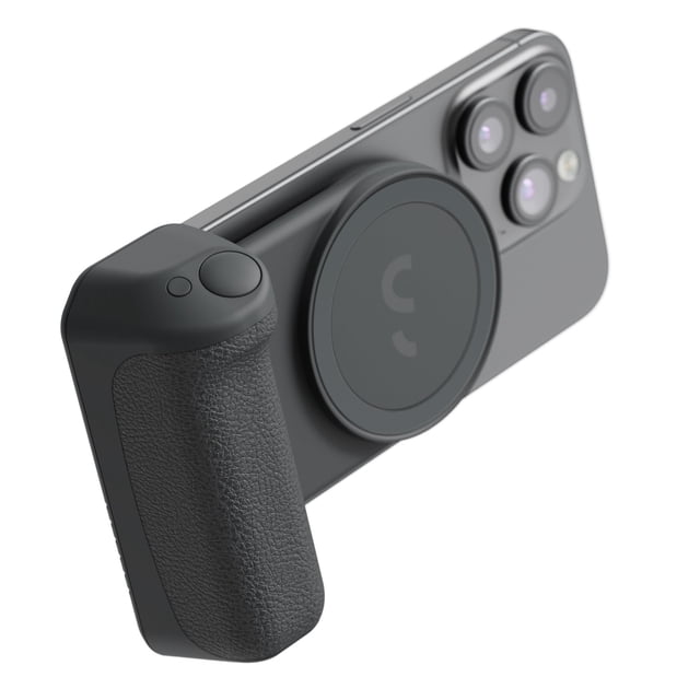 ShiftCam SnapGrip Pro Magnetic Smartphone Battery Grip with Qi2 Wireless Charging in midnight color attached to a smartphone, featuring a textured ergonomic grip with shutter button and a circular magnetic wireless charging pad near the phone's triple camera lenses.