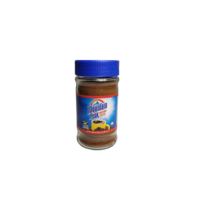 AL PREMIUM JAMAICA MOU P IN CFF Mountain Peak Instant Coffee in a 100g clear glass jar with a blue lid, featuring a blue and red label with a yellow coffee cup and coffee beans, known for its bold, aromatic Jamaican flavor and quick preparation by adding hot water.