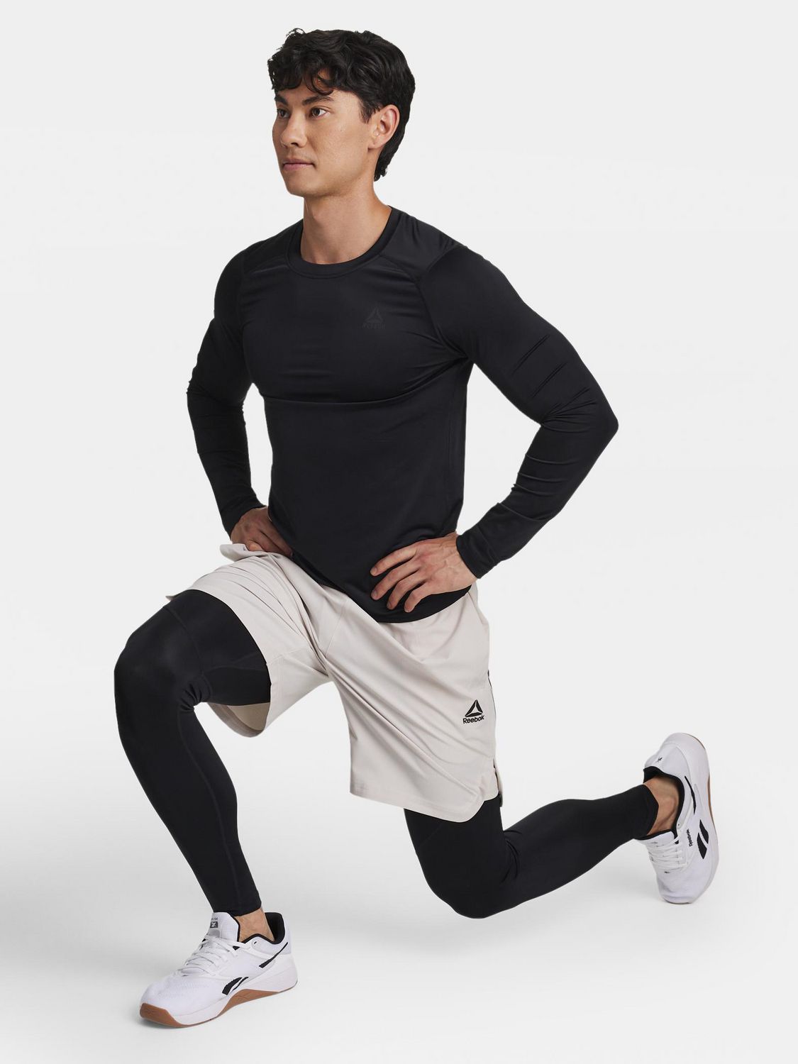 Reebok Haut de compression à manches longues et col rond pour homme