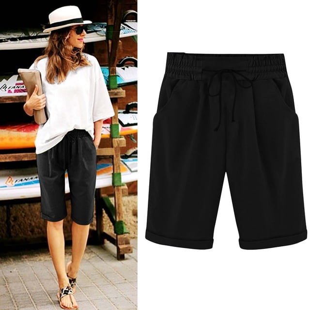 DPTALR Women's Summer Elastic Waist Drawstring Side Pocket Solid Color Short Pants 5/4 in black. These casual shorts feature an elastic waistband with a drawstring, side pockets, and a high-waist design. Made from polyester, they are lightweight and suitable for all seasons. The image shows the shorts styled with a white top and sandals, ideal for seaside holidays or casual outings.