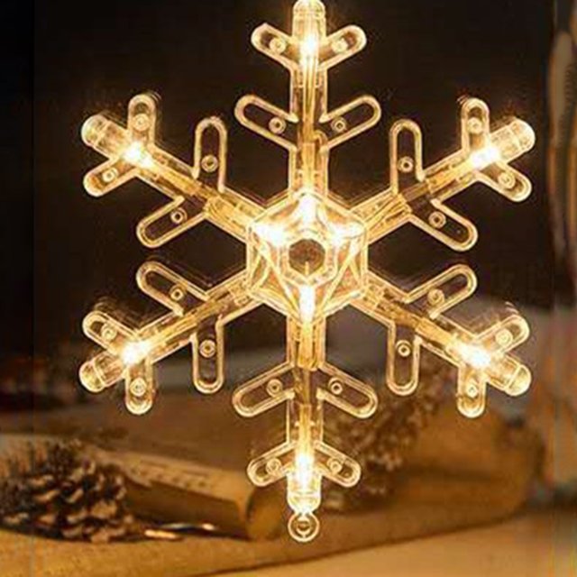 Yeacher Hanging Fairy LEDs String Lights Curtain Lamp with snowflake design, featuring warm white constant bright modes. The snowflake-shaped light is illuminated with LED bulbs, creating a cozy and festive atmosphere. Ideal for holiday lighting, parties, and indoor use with IP42 water resistance.