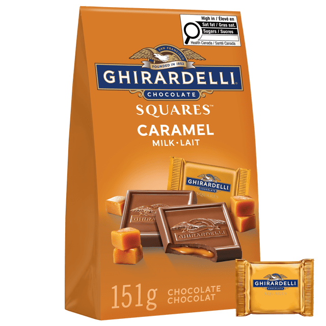 GHIRARDELLI Milk Chocolate Caramel Squares, 151-Gram Bag individually wrapped milk chocolate squares shown front-facing; one square unwrapped and torn open to reveal flowing caramel centre and smooth milk chocolate interior on a plain white background; suitable for party favors or gifting.