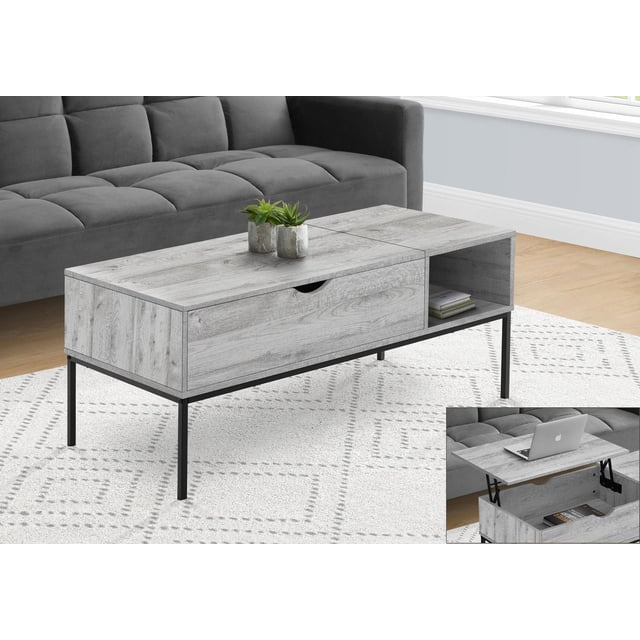 Monarch Specialties Table Basse, Table de cocktail Rectangulaire de 42 Pouces de long avec Dessus en Stratifié Aspect Bois Gris et Pattes en Métal Noir, Dotée d'Un Dessus Relevable à Charnières pour Ordinateur Portable et Rangement Caché, plus une Tablette Latérale Ouverte pour Livres, Présentée dans un Salon Moderne avec un sofa Gris et un Tapis à Motifs.