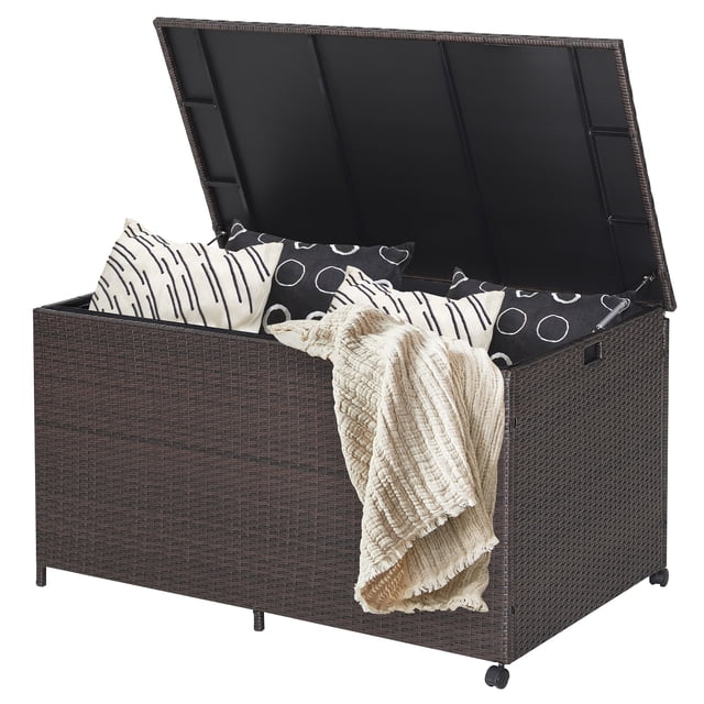 Costway 133 Gallon Patio Rattan Storage Deck Box Container with a mix brown PE rattan exterior, open lid revealing spacious interior storage with cushions and a blanket. Designed for outdoor use, it features pneumatic rods for safe lid operation, built-in handles, and 360° rotatable wheels for easy mobility. Ideal for backyards, patios, or poolside as a deck box or outdoor storage solution.