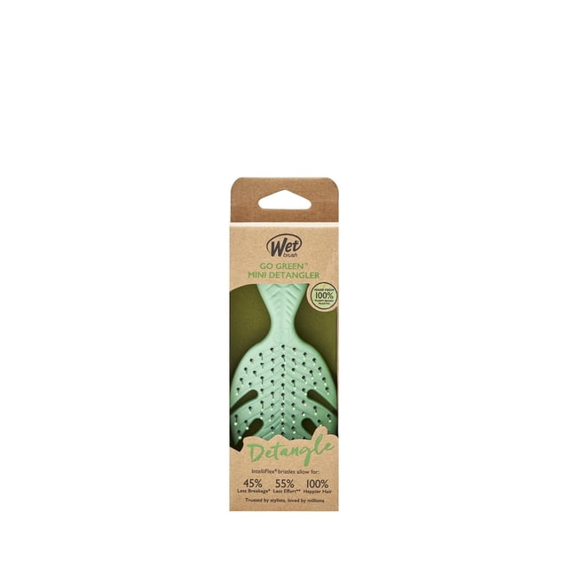 WETBRUSH WB GO GREEN DETANGLER Assortment showing a palm-sized mini detangler brush in light green with IntelliFlex bristles for gentle detangling, packaged in eco-friendly brown cardboard made from 100% plant-based plastic, designed to reduce hair breakage and effort on all hair types.