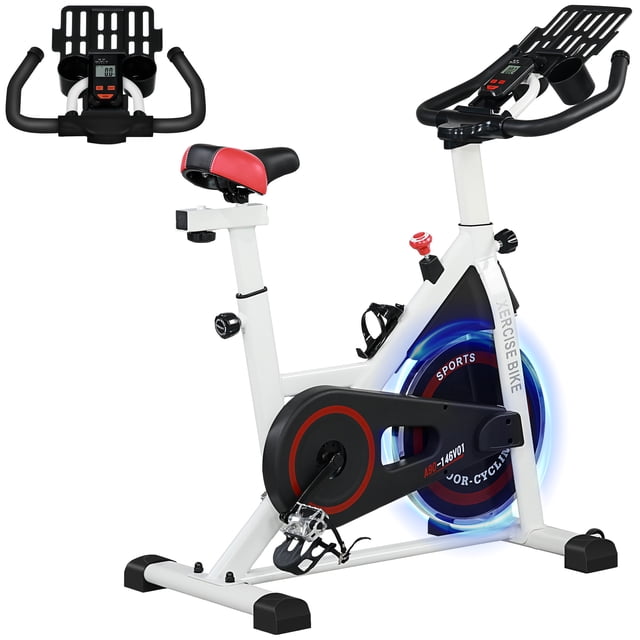 Soozier Adjustable Upright Stationary Exercise Bike in white with black and red accents, featuring an LCD display for tracking time, speed, distance, and calories burned. The bike includes adjustable seat and handlebar heights with 7 levels, a 17.6 lbs flywheel, and a resistance knob with an emergency stop function. Designed with a padded seat, handle grips, and pedals with toe cages for comfort and safety. Includes a tray for holding water bottles and phones, and two rolling wheels for easy mobility. Constructed with steel and ABS materials, it supports up to 264 lbs and measures 40.6 inches long, 20.9 inches wide, and 39.4 to 44.9 inches high.