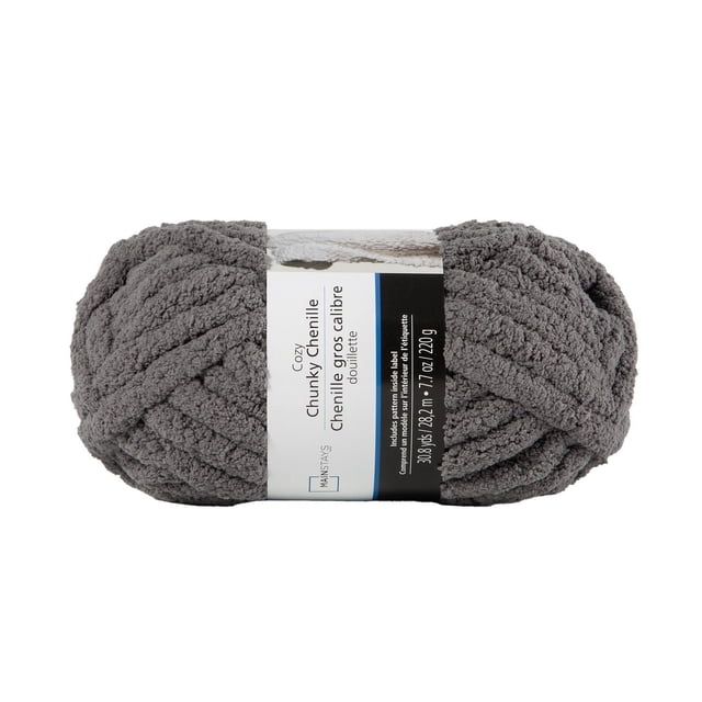 MAINSTAYS Grey Chunky chenille yarn skein featuring thick, soft polyester fibers in textured grey, labeled 30.8 yards (28.2 meters) and 7.7 ounces (220 grams), suitable for knitting chunky blankets, pillows, scarves, and cozy home décor projects.