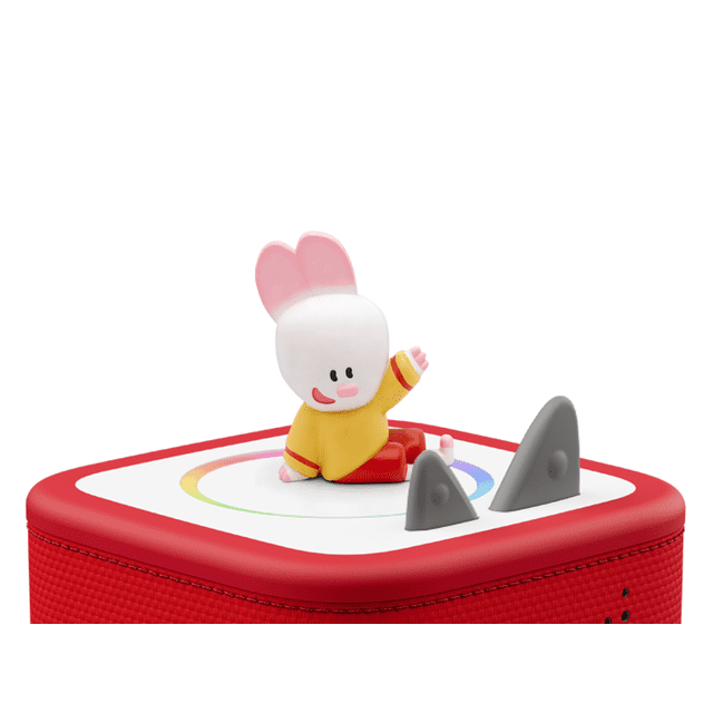 Tonies - FRENCH - Dessine Moi Avec Didou figurine in yellow and red sitting on a red and white square Toniebox audio player with rounded corners, featuring a multicolour circular design and two gray triangular control knobs, designed for screen-free educational play in French for children ages 3 and up.