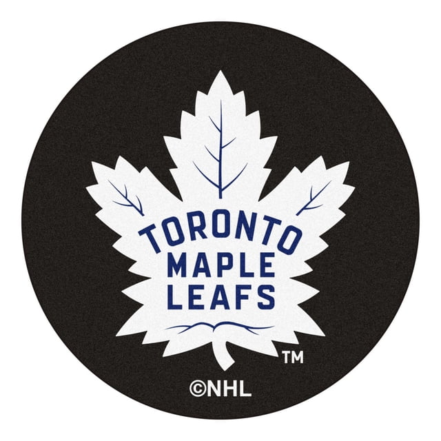 NHL Toronto Maple Leafs Hockey Puck Rug with a 27-inch round black nylon surface featuring the white Toronto Maple Leafs logo and blue text, non-skid recycled vinyl backing, machine washable, suitable as a sports fan accent rug or doorway mat.